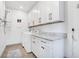 Bright laundry room with white cabinets, granite countertops, and washer/dryer at 2827 11Th N Ave, St Petersburg, FL 33713