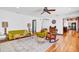 Mid-century modern living room with hardwood floors and a large window at 2827 11Th N Ave, St Petersburg, FL 33713