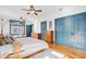 Spacious main bedroom with a king-size bed, built-in cabinets, and hardwood floors at 2827 11Th N Ave, St Petersburg, FL 33713