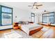 Spacious main bedroom with a king-size bed, built-in cabinets, and hardwood floors at 2827 11Th N Ave, St Petersburg, FL 33713