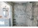 Walk-in shower with tile surround and multiple shower heads at 2827 11Th N Ave, St Petersburg, FL 33713