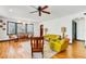 Open living space with hardwood floors, built-in shelving, and a ceiling fan at 2827 11Th N Ave, St Petersburg, FL 33713