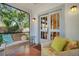 Relaxing screened porch with wicker furniture and access to backyard at 2827 11Th N Ave, St Petersburg, FL 33713