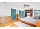 Spacious main bedroom with a king-size bed, built-in cabinets, and hardwood floors at 2827 11Th N Ave, St Petersburg, FL 33713