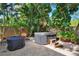 Spacious backyard with hot tub, patio furniture, and lush landscaping at 2827 11Th N Ave, St Petersburg, FL 33713