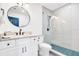 Modern bathroom with white cabinets, a large mirror, and a walk-in shower at 2827 11Th N Ave, St Petersburg, FL 33713
