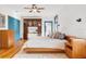 Spacious main bedroom with a king-size bed, built-in cabinets, and hardwood floors at 2827 11Th N Ave, St Petersburg, FL 33713