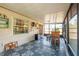 Screened porch with bar, patterned floor, and view of backyard at 5534 Atlantic N Ave, St Petersburg, FL 33703