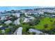 Aerial showing condo community near the water with tennis courts and pool at 11520 Shipwatch Dr # 1386, Largo, FL 33774