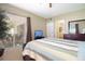 Bedroom with a striped comforter and view of the patio at 11520 Shipwatch Dr # 1386, Largo, FL 33774