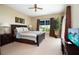 Spacious bedroom with a king-size bed and access to a patio at 11520 Shipwatch Dr # 1386, Largo, FL 33774