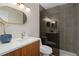 Modern bathroom with a walk-in shower and updated vanity at 1 Gateshead Dr # 209, Dunedin, FL 34698