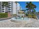 Elegant fountain with crane statues in the courtyard at 1 Gateshead Dr # 209, Dunedin, FL 34698