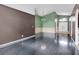 Bright living room featuring dark hardwood floors and two-toned walls at 5204 New Brittany Ln, Zephyrhills, FL 33541
