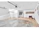 Spacious garage, offering extra storage with shelving at 5204 New Brittany Ln, Zephyrhills, FL 33541