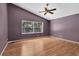 Spacious bedroom with hardwood floors, ceiling fan and window at 5204 New Brittany Ln, Zephyrhills, FL 33541