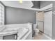 Bathroom with tub, toilet and shower at 5204 New Brittany Ln, Zephyrhills, FL 33541