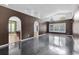 Spacious living room with dark hardwood floors and high ceilings at 5204 New Brittany Ln, Zephyrhills, FL 33541