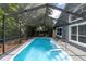Refreshing screened pool with ample deck space at 5204 New Brittany Ln, Zephyrhills, FL 33541