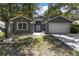 Two-car garage and attractive curb appeal at 5204 New Brittany Ln, Zephyrhills, FL 33541