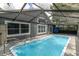 Relaxing screened-in pool and patio area at 5204 New Brittany Ln, Zephyrhills, FL 33541