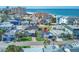 Aerial view showing home's location near beach, in a neighborhood of similar homes at 142 Beach Ave, Redington Shores, FL 33708