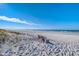 Relaxing beach view with a bench overlooking the ocean at 142 Beach Ave, Redington Shores, FL 33708