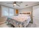 Main bedroom with a ceiling fan and large bed at 142 Beach Ave, Redington Shores, FL 33708