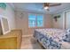 Bedroom with starfish bedding, dresser, and window shutters at 142 Beach Ave, Redington Shores, FL 33708