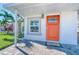 Inviting front door with a welcome mat and a covered entryway at 142 Beach Ave, Redington Shores, FL 33708