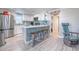 Modern kitchen with white cabinets and stainless steel appliances at 142 Beach Ave, Redington Shores, FL 33708