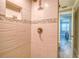 Modern shower with updated tile and fixtures at 142 Beach Ave, Redington Shores, FL 33708