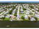 Aerial view of waterfront home and neighborhood at 2248 Society Dr, Holiday, FL 34691