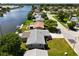 Wide aerial view of waterfront home and neighborhood at 2248 Society Dr, Holiday, FL 34691