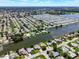 Aerial view of canal-front homes and community at 2248 Society Dr, Holiday, FL 34691