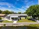 Aerial view showcasing home, backyard, and canal at 2248 Society Dr, Holiday, FL 34691