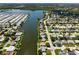 Aerial view of canal-front homes and community at 2248 Society Dr, Holiday, FL 34691