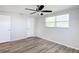 Bright bedroom with vinyl flooring, ceiling fan and window at 2248 Society Dr, Holiday, FL 34691