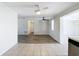 Living area with wood-look vinyl flooring and ceiling fan at 2248 Society Dr, Holiday, FL 34691
