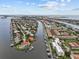 Wide aerial view of condo, highlighting its waterfront location and surroundings at 719 Pinellas Bayway S # 310, Tierra Verde, FL 33715