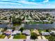 Aerial view of the neighborhood, highlighting the property's canal-front location at 2248 Society Dr, Holiday, FL 34691