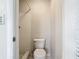 Small bathroom with shower, toilet, and neutral tile at 2248 Society Dr, Holiday, FL 34691