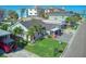 Aerial view of a single-story house with a yard, close to the beach at 142 Beach Ave, Redington Shores, FL 33708