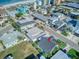 An aerial view of a home situated near the beach in a residential setting at 142 Beach Ave, Redington Shores, FL 33708