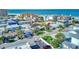 Aerial perspective of a beachfront home and its surrounding neighborhood at 142 Beach Ave, Redington Shores, FL 33708