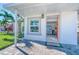 House exterior with an orange door and paved walkway at 142 Beach Ave, Redington Shores, FL 33708
