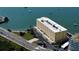 Breathtaking aerial view of the waterfront condo with stunning views and convenient access to the beach and nearby amenities at 100 Bluff View Dr # 405C, Belleair Bluffs, FL 33770