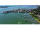 Breathtaking aerial view of the area highlighting a waterfront neighborhood and lush landscaping at 100 Bluff View Dr # 405C, Belleair Bluffs, FL 33770