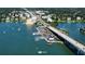 An aerial view of the coastal community with bridge and scenic waterfront at 100 Bluff View Dr # 405C, Belleair Bluffs, FL 33770