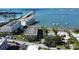Stunning aerial view of waterfront buildings, a bridge, and boats on the sparkling water at 100 Bluff View Dr # 405C, Belleair Bluffs, FL 33770
